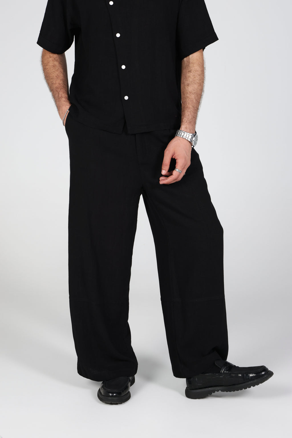 Black wide-leg linen trousers