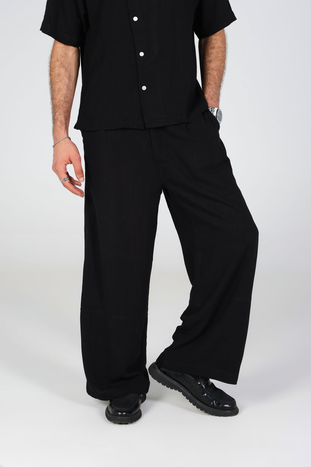 Black wide-leg linen trousers